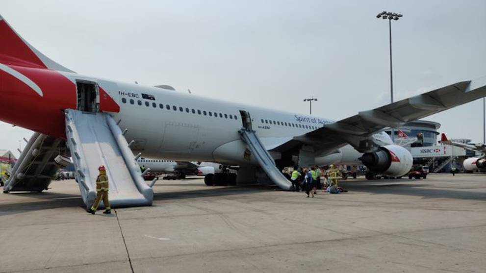 Passengers Evacuate Qantas Plane Via Emergency Slides At Sydney Airport Up Station Singapore - qantas airways roblox